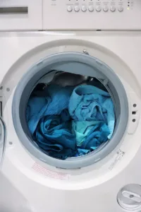 washing machine open with clothes inside