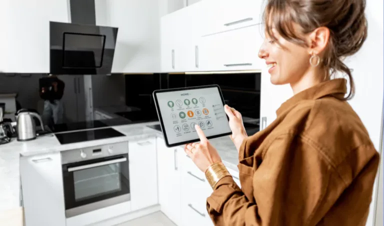 woman in kitchen with tablet and smart appliances